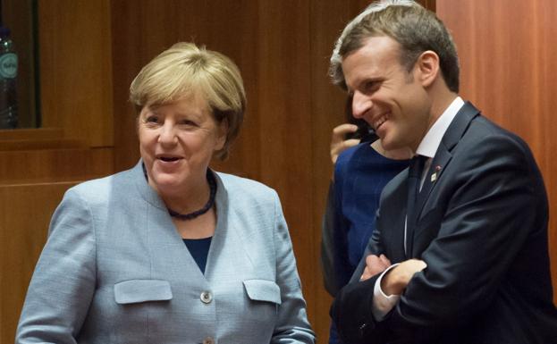 Angela Merkel y Emmanuel Macron, este jueves en Bruselas. /AFP
