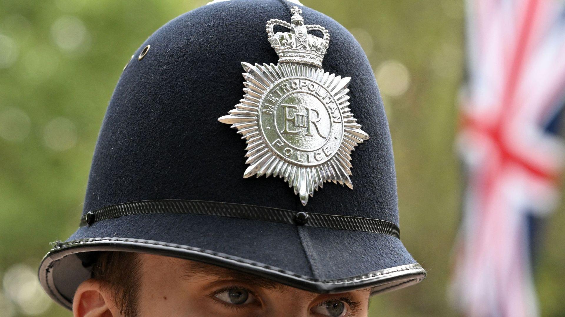 The British police uniform also has the emblem of Elizabeth II on the helmet.