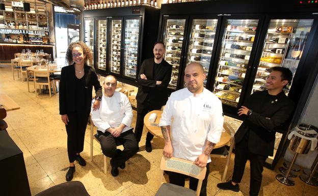 Raúl Cabrera (seated) poses with the La Bodega team.