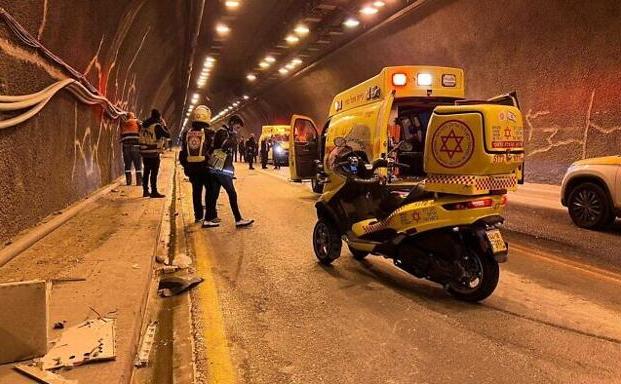 Emergency services work at the crash site, in the Route 60 tunnel in Jerusalem.